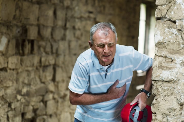 Photo shows worker clutching heart