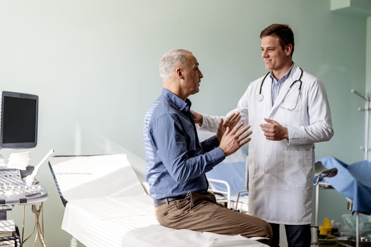 Caring doctor listens to patient