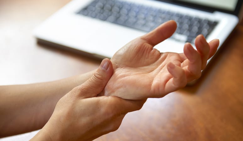 Photo shows woman with carpal tunnel syndrome