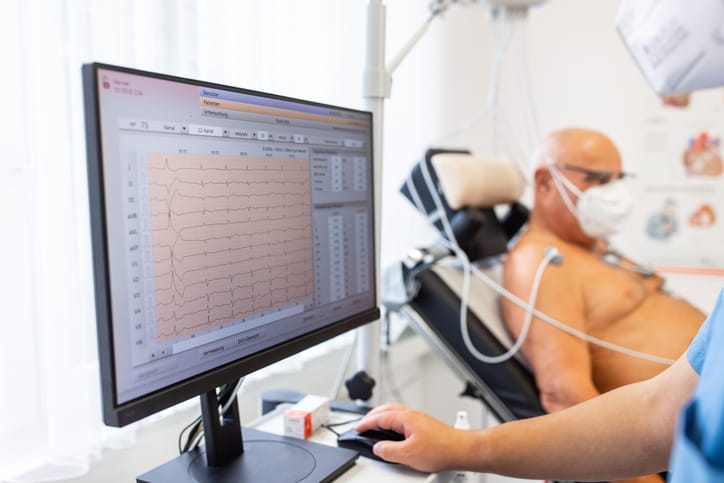 Photo shows man receiving a cardiac test