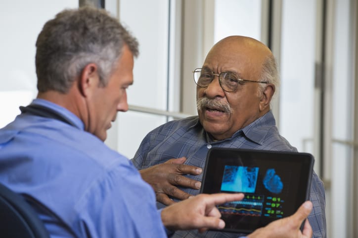 Photo shows man with doctor