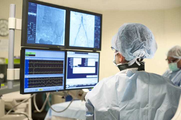 Photo shows doctor with heart monitor